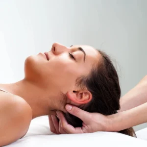 A woman receiving a relaxing head massage.