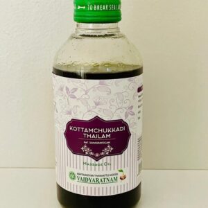 A bottle of organic black sesame tahini with a green cap.